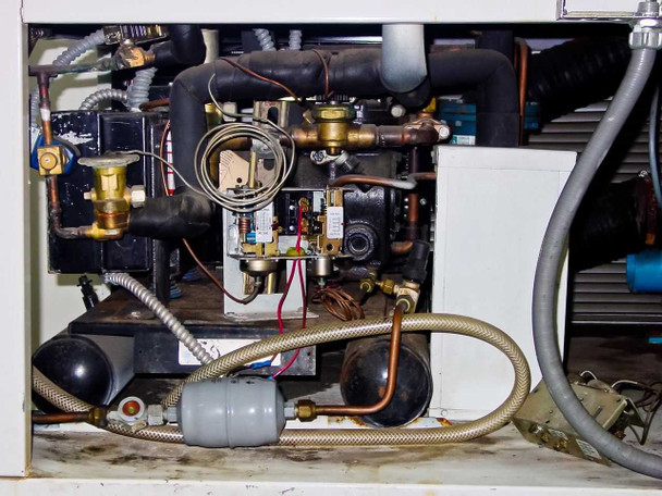 Alliance environmental chamber refrigeration and mechanical bay showing copper piping, compressor components, solenoid valves, and wiring