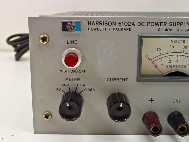 HP Harrison 6102A DC Power Supply – left front panel close-up showing LINE push on/off switch, METER selector knob (50V/0.6A/5V/0.06A), CURRENT knob, and output binding posts