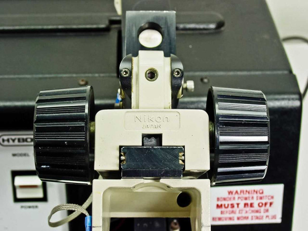 Nikon SMZ-1 stereo zoom microscope head mounted on Hybond 512 wire bonder, close-up of zoom body and focus knobs