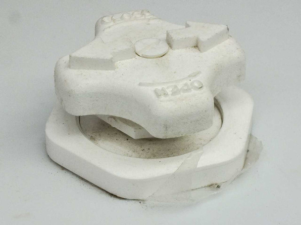 Close-up of white polymer or ceramic anti-vibration/isolation mount component with circular ring design and OPEN markings