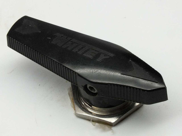 Close-up of Whitey brand quarter-turn ball valve with black handle showing WHITEY logo embossed on handle