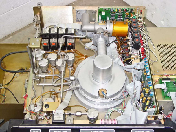 Tegal 803 interior top view with cover removed showing reaction chamber, RF matching network coil, gas plumbing, and PCBs