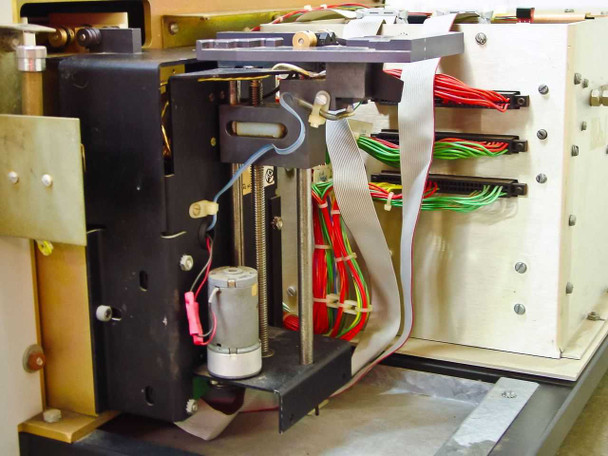 Tegal 803 left side wafer elevator assembly showing motorized lead-screw transport and ribbon cable harness