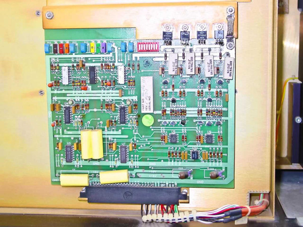 Tegal 803 main control PCB close-up showing green circuit board with ICs, capacitors, and power transistors