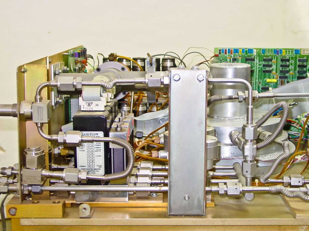Tegal 803 interior side view showing MFC (mass flow controller) gas manifold assembly with stainless fittings and process gas lines