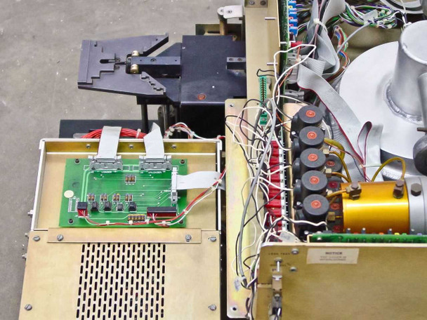Tegal 803 interior right-side view showing motion PCB, secondary control board, wafer handler arm, and RF transformer coil assembly