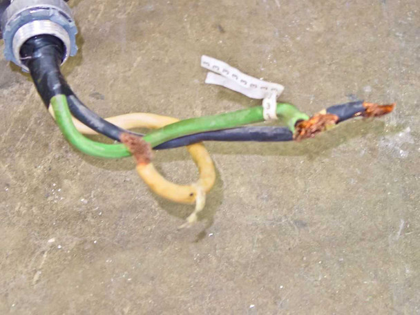 Tegal 803 – close-up of main power cable end showing bare conductors with corrosion on wire ends (black, green, yellow conductors)