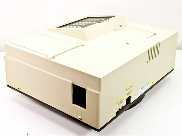 Beckman DU-65 spectrophotometer left-side and rear quarter view showing IEC power inlet and caution labels