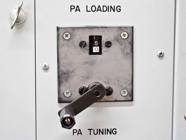 Close-up of PA Loading rotary switch and PA Tuning lever arm control on front panel of Plasma-Therm HFS-10000D