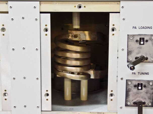 Interior view of PA section showing large copper coil inductor (tube socket area) with PA Loading and PA Tuning controls visible to the right — tube absent from socket