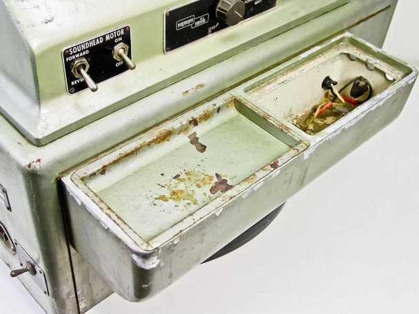 Moviola UK-20-S/35 – lower drawer fully open showing SOUNDHEAD MOTOR forward/reverse toggle switch and tray interior with rust, debris, and wire connectors