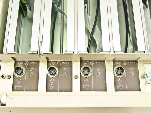 Bottom rear panel showing four channel Signal Input and Monitor circular connectors with 1 OUT and GUARD terminals