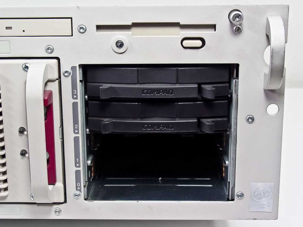 Compaq ProLiant 6400R empty hot-plug hard drive bays — no drives installed, Compaq drive carriers visible