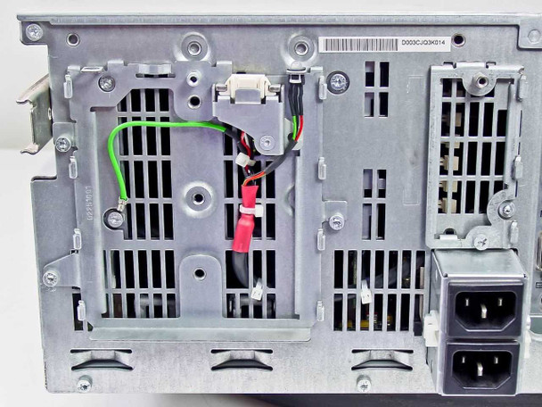 Compaq ProLiant 6400R rear interior showing fan mounting area, power supply bay, and IEC power inlet connector