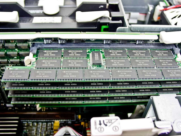 Compaq ProLiant 6400R memory board close-up showing multiple DIMM slots populated with RAM modules, Korea-stamped chips