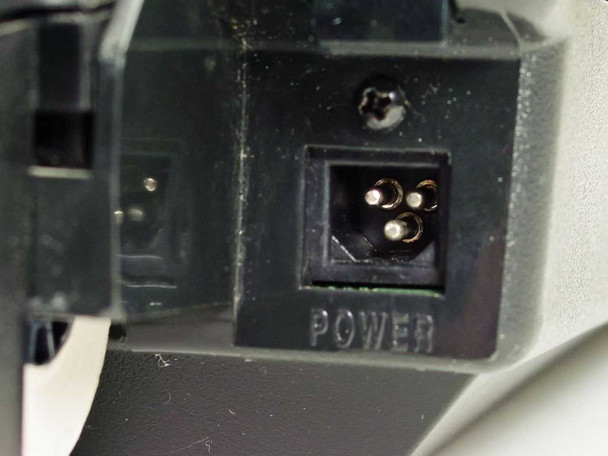 Hypercom T7P-T power connector close-up showing proprietary DC power jack with no supply attached