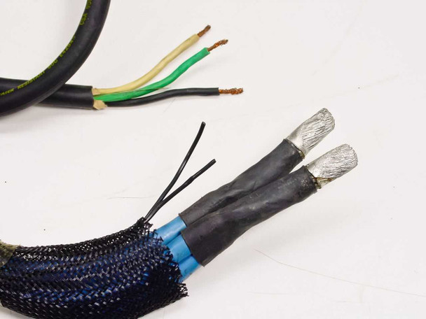 Advanced Energy PE-10/20K power cable ends showing bare wire leads — one three-conductor cable (green/yellow/black) and one dual-conductor shielded cable with foil-wrapped terminations