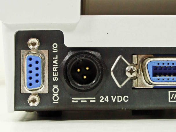Zebra Bravo Desktop Printer rear panel close-up showing DB-9 Serial I/O port and 4-pin DIN power connector labeled 24 VDC