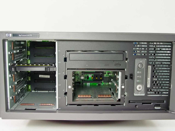HP ProLiant ML370 front panel view with side panel removed showing empty hot-swap drive bays, CD-R drive, and floppy bay