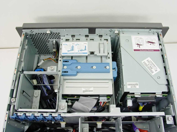 HP ProLiant ML370 interior side view showing drive cage area, cabling, and optical drive bay with internal components