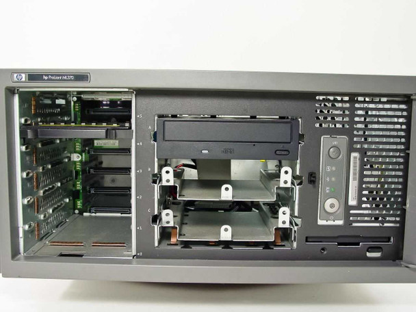 HP ProLiant ML370 front view with cover removed showing empty hot-swap HDD bays, CD-R optical drive, and floppy bay