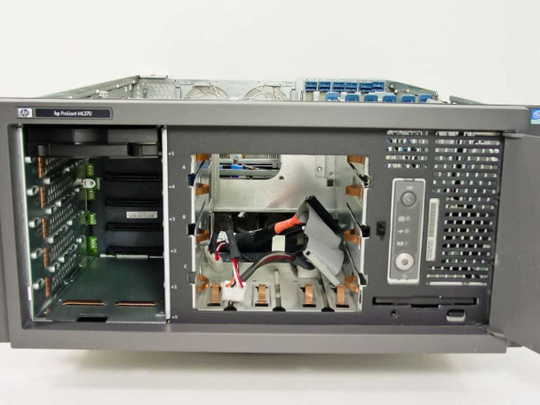 HP ProLiant ML370 front view showing open chassis, empty hot-swap drive bays, floppy drive, and optical drive bay