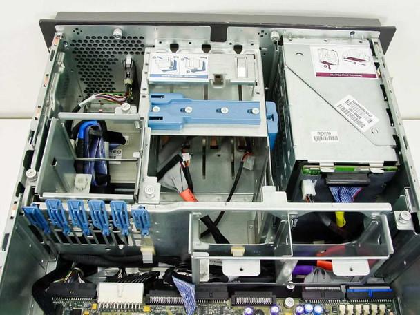 HP ProLiant ML370 interior top-down view showing drive cage area, cabling, drive backplane, and optical drive bay