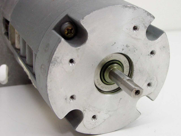 Yaskawa T08L-TL11 Minertia Mini Series brushless DC servo motor – output shaft end showing bearing and machined aluminum face plate