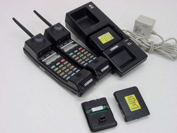 AT&T MDW 9000 two cordless handsets with antennas extended, charging cradle open, AC adapter, and two battery packs on white background