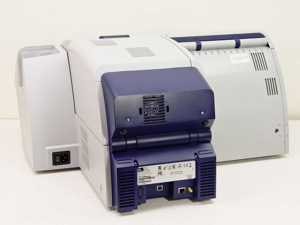Zebra ZXP Series 8 rear view showing IEC power inlet, ventilation grilles, and compliance labels