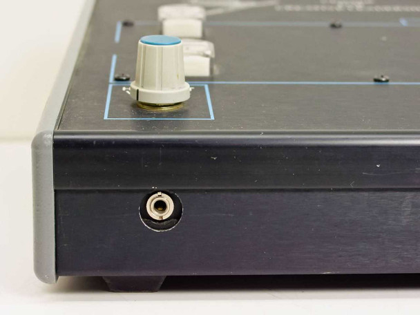 Tele-Images 84386 console – left side panel showing 1/4-inch jack and headset volume knob
