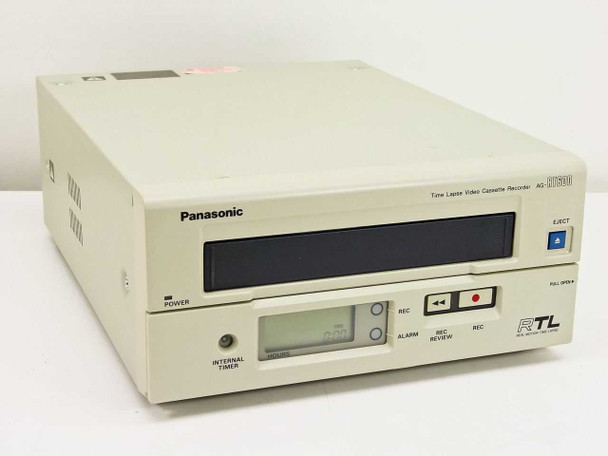 Panasonic AG-RT600P Time Lapse VHS Recorder — front panel three-quarter view showing VHS cassette bay, LCD timer display, REC and transport controls, and RTL branding