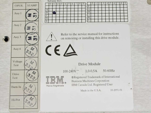 IBM tape drive module internal assembly label showing 100-240V 1.0-0.5A 50-60Hz power rating, CE mark, Made in U.S.A., assembly stamps