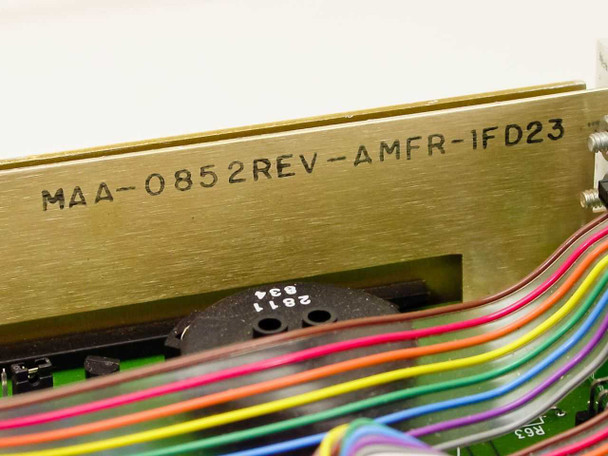 APC MAA-0852 chassis label showing model stamp MAA-0852REV-AMFR-1FD23 on gold metal enclosure with internal wiring visible