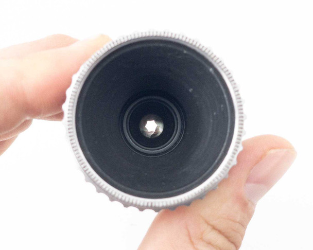 Kodak Cine Ektar 15mm f/2.5 – rear mount view held in hand showing S-Mount threads and rear glass element with aperture blades