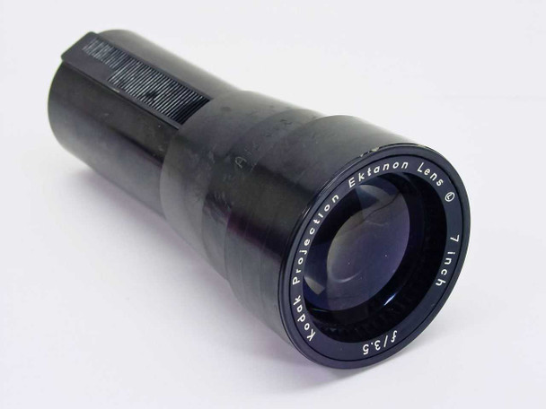 Kodak Ektanon 7 Inch f/3.5 Projection Lens — three-quarter front view showing black barrel, focus ring, and front element with Kodak lettering