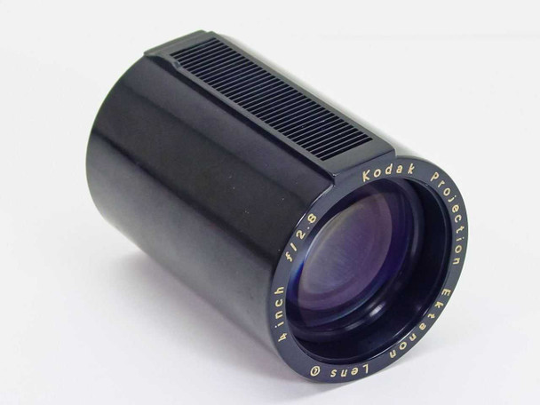Kodak Projection Ektanon 4 inch f/2.8 carousel lens — three-quarter front view showing ribbed focus ring and gold lettering on black barrel