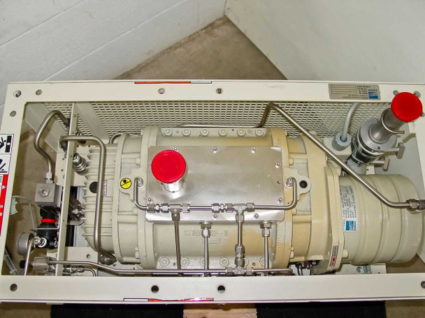 Ebara 40X20 top-down internal view showing dry screw pump body with red caps, stainless plumbing, and internal wiring layout