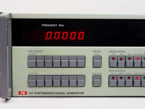 RE 107 Synthesized Signal Generator front panel close-up — FREQUENCY MHz LED display reading .00000, FREQUENCY INCREASE/DECREASE buttons, RESOL and MODULATION mode buttons, MOD SOURCE selector buttons
