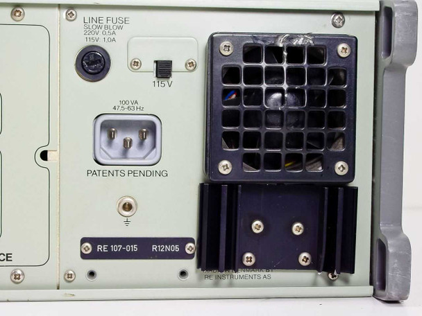 RE 107 Synthesized Signal Generator rear panel power section — LINE FUSE label (Slow Blow, 220V 0.5A / 115V 1.0A), voltage selector set to 115V, 100 VA IEC power inlet, exhaust fan grille, RE 107-015 R12N05 label plate