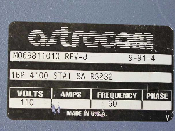 Astrocom 4100 rear nameplate label showing part number M069811010 REV-J, date code 9-91-4, 16P 4100 STAT SA RS232, 110V 60Hz, Made in U.S.A.