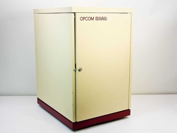 Opcom D.I.A.L. PBX telephone answering system – front view of cream and burgundy floor-standing cabinet with door closed