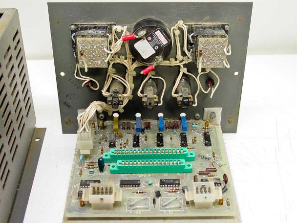 Rear view of Thermco control panel PCB showing four power transformers or relay modules, electromechanical components, and green terminal strip PCB below