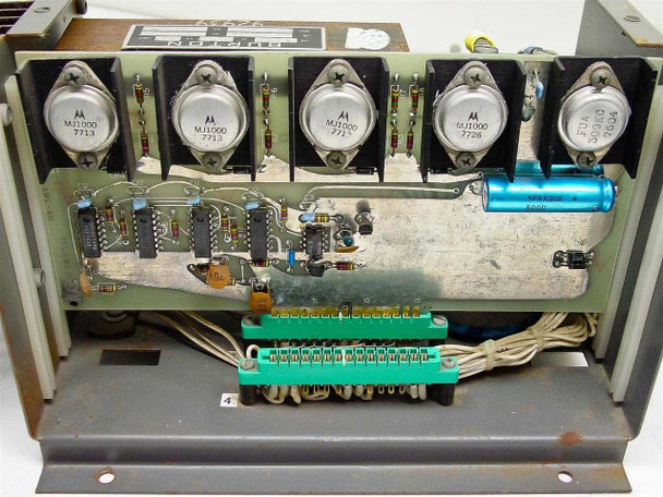 Interior of Thermco power supply chassis showing five Motorola MJ1000 NPN power transistors on heatsink rail, green PCB with ICs and terminal strips, and large electrolytic capacitor