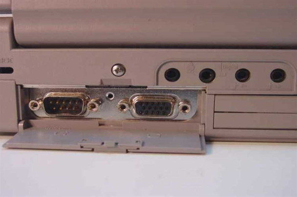 Toshiba Tecra 750CDM rear port bay showing DB-9 serial port and DB-15 VGA port with audio jacks