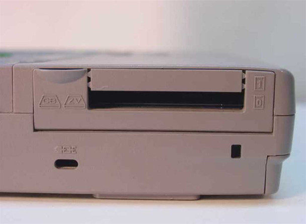 Toshiba Tecra 750CDM right side close-up showing PCMCIA card slot with eject button