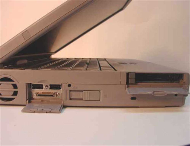 Toshiba Tecra 750CDT right side view showing exhaust vent, parallel port, PC Card slot with card, and floppy drive