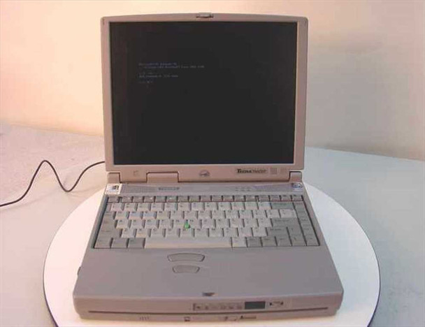 Toshiba Tecra 750CDT laptop open front view showing keyboard, trackpad, and display with blue boot screen