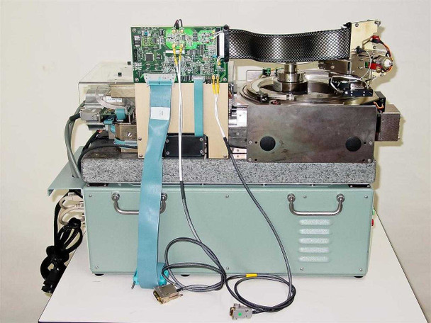 Guzik S1701 SpinStand rear view showing ribbon cables, DB connectors, interconnect cabling, and ancillary PCB assembly