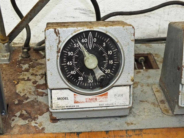 Beseler timer unit with analog 0–60 second dial face, heavy surface wear and corrosion on housing, Charles Beseler Co. label